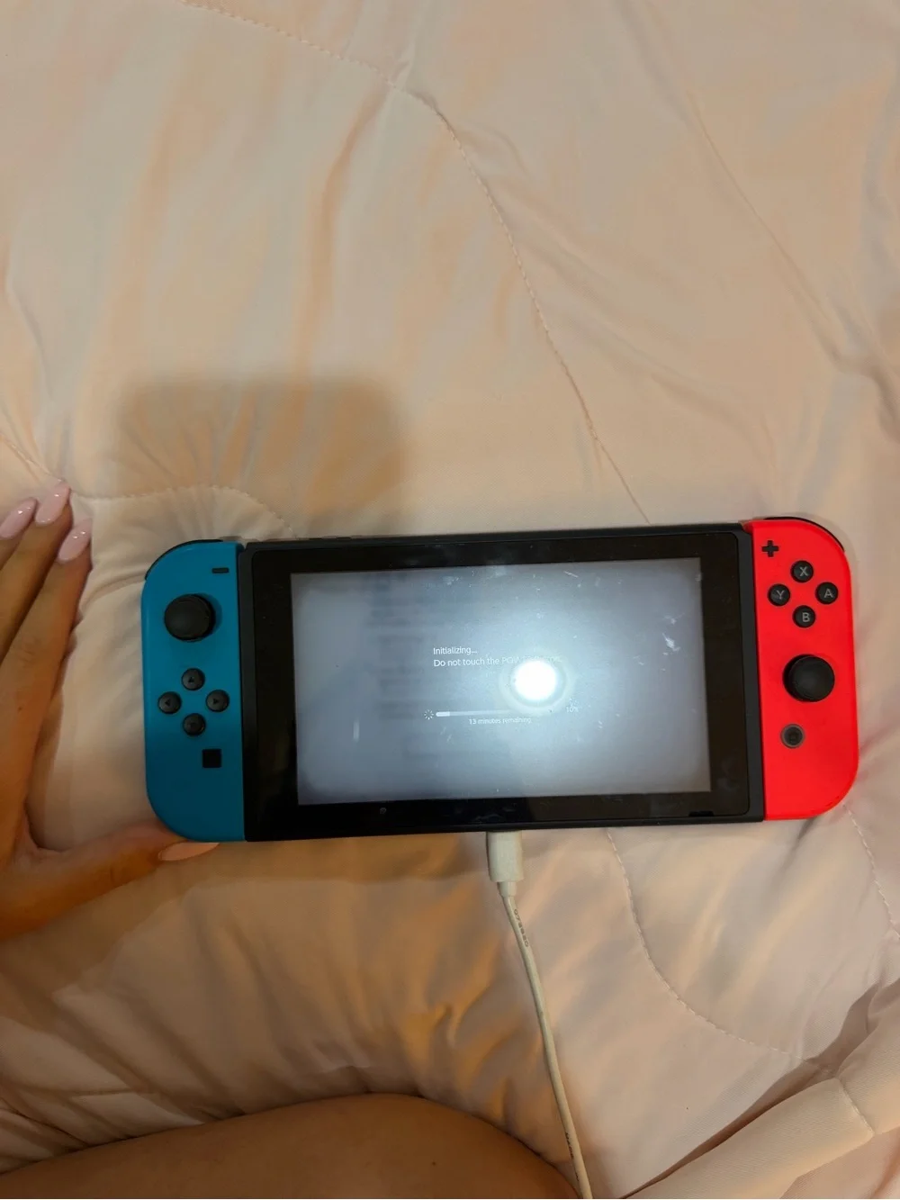 Handheld Gaming Console with Blue and Red Joy-Cons